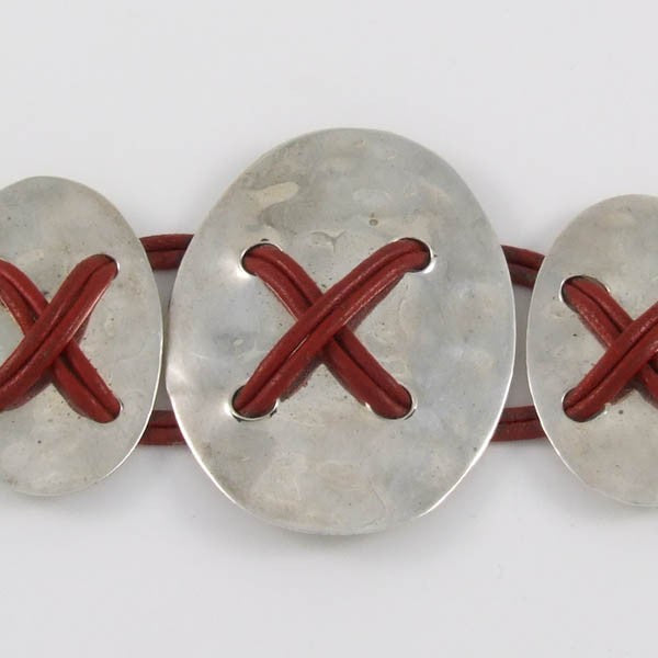 Ovals Tied with Leather Straps