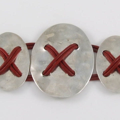 Ovals Tied with Leather Straps