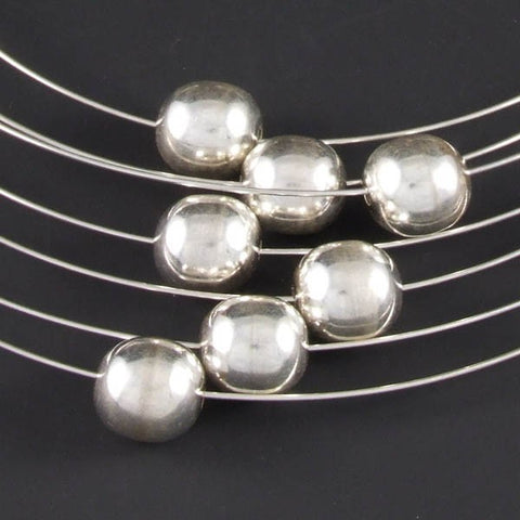 Wires with Silver Marbles